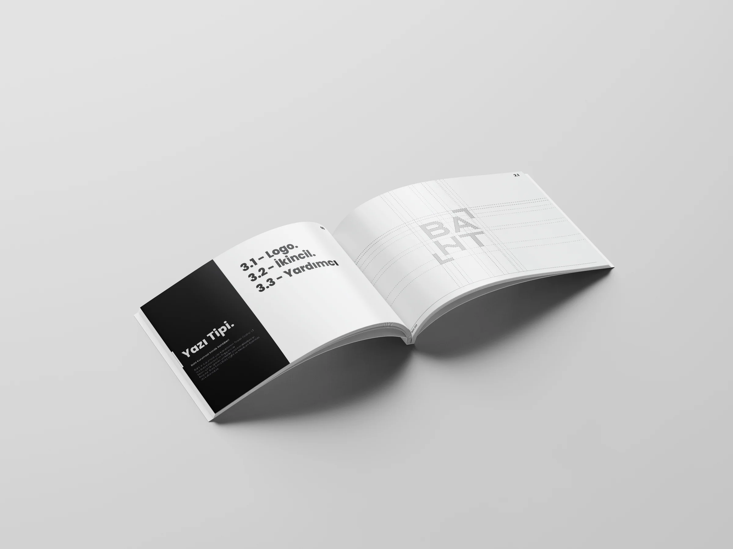 Guide spread: a half-black typography section opener on the left, the baht logo on a construction grid on the right.