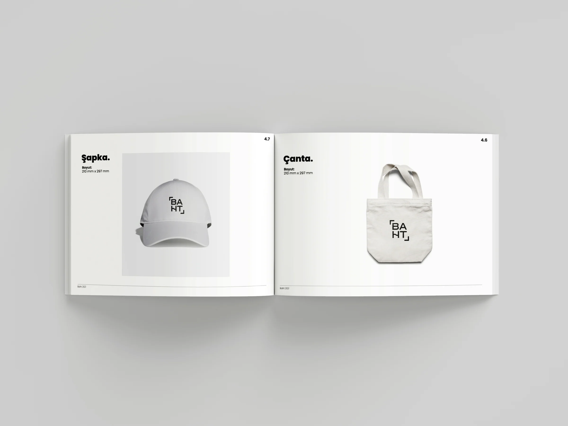 Guide spread with a white cap and a canvas tote bag, each carrying the baht logo.