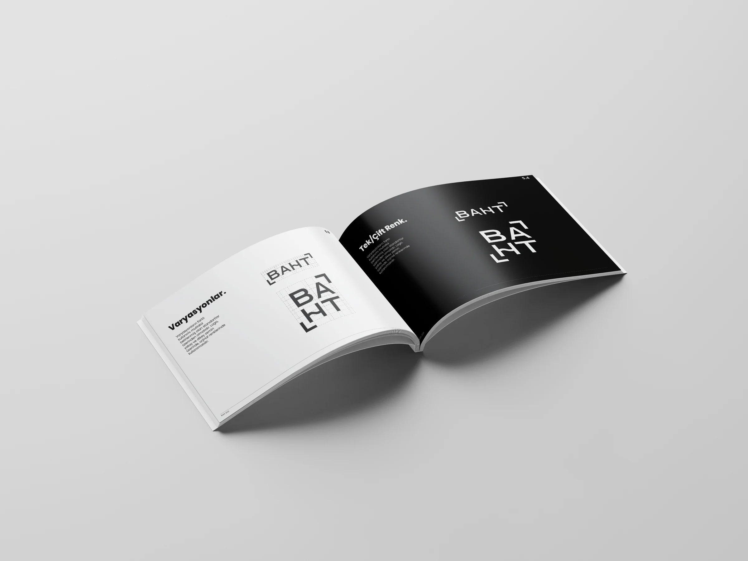 Guide spread of horizontal and stacked logo variations, with a black facing page showing both versions in white.
