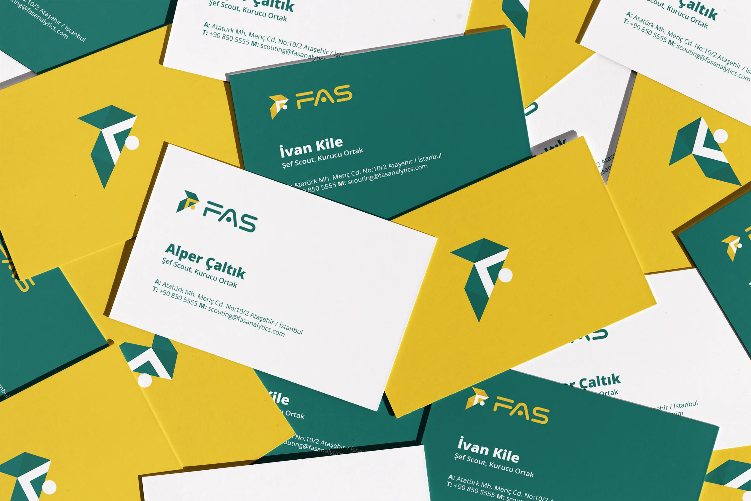 Scattered FAS business cards in green, yellow and white, with the logo mark, wordmark, names and contact details.