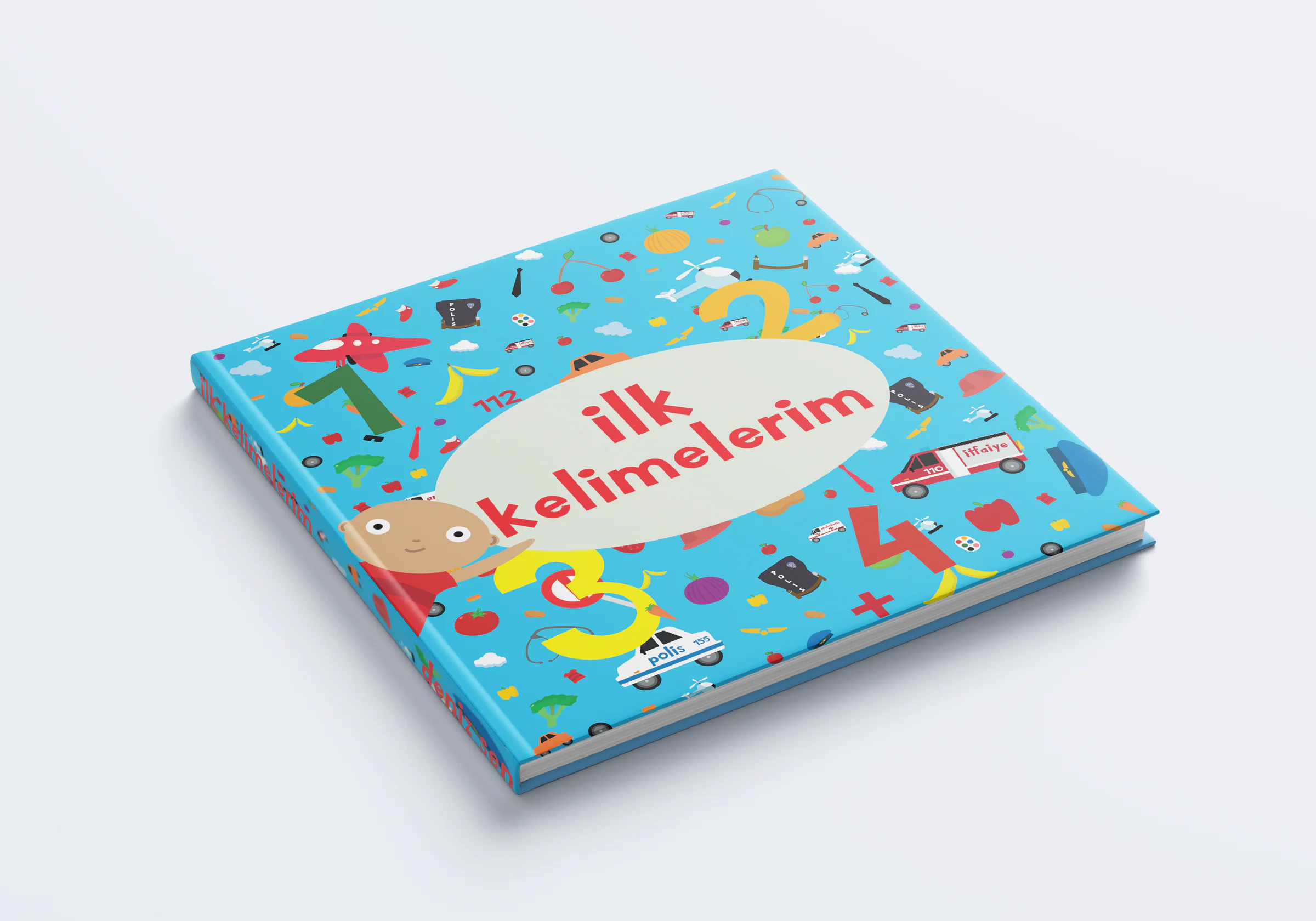 İlk Kelimelerim hardcover lying flat: red title in a pale oval on blue, a peeking child and small drawings of vehicles, fruit and numbers.