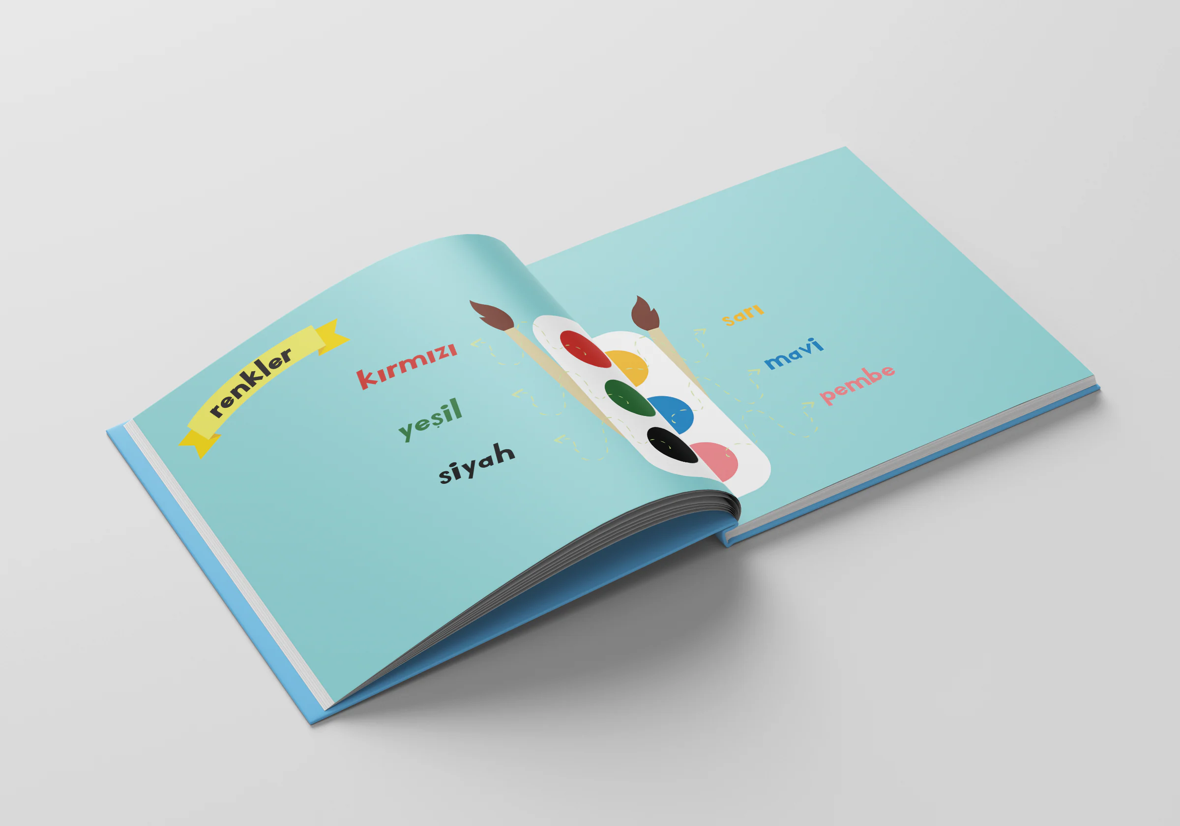 Spread titled renkler (colours): colour words set in matching hues beside a paint palette and two brushes on pale teal.