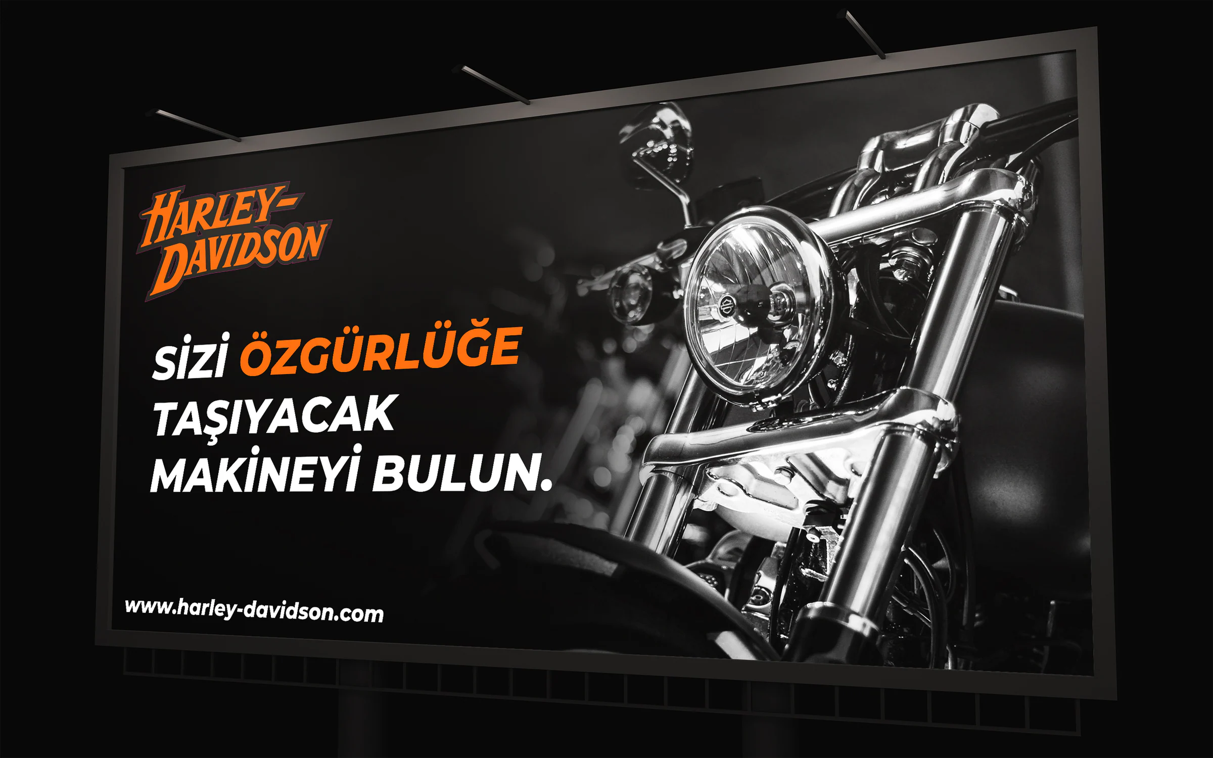 Harley-Davidson billboard: monochrome motorcycle headlamp and a Turkish line meaning "find the machine that will carry you to freedom".