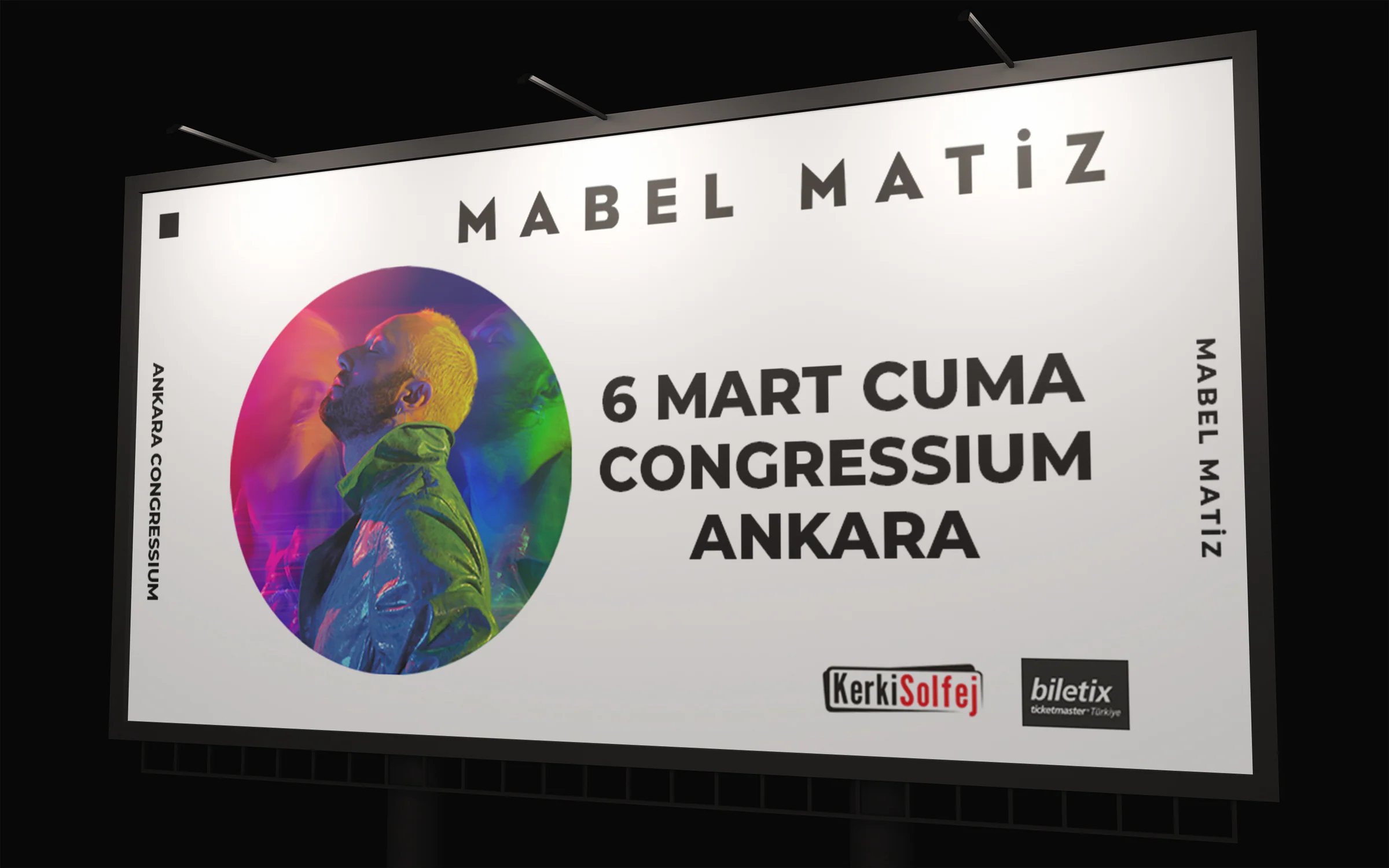 White billboard announcing Mabel Matiz at Congressium Ankara on Friday 6 March, with a round portrait lit in rainbow colours.