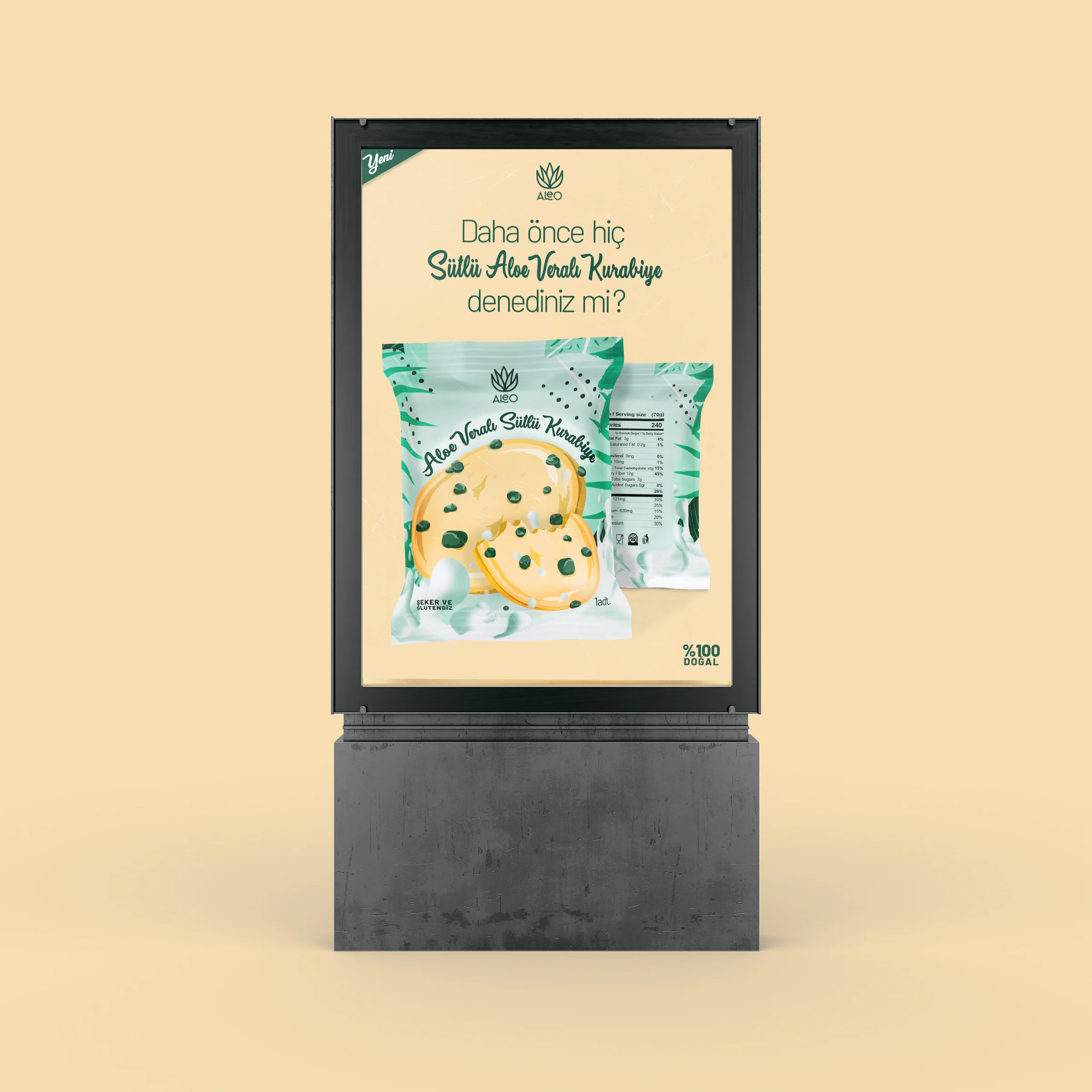 Street poster stand showing the front and back of the Aleo pouch under a Turkish headline asking if you have tried aloe vera milk cookies.